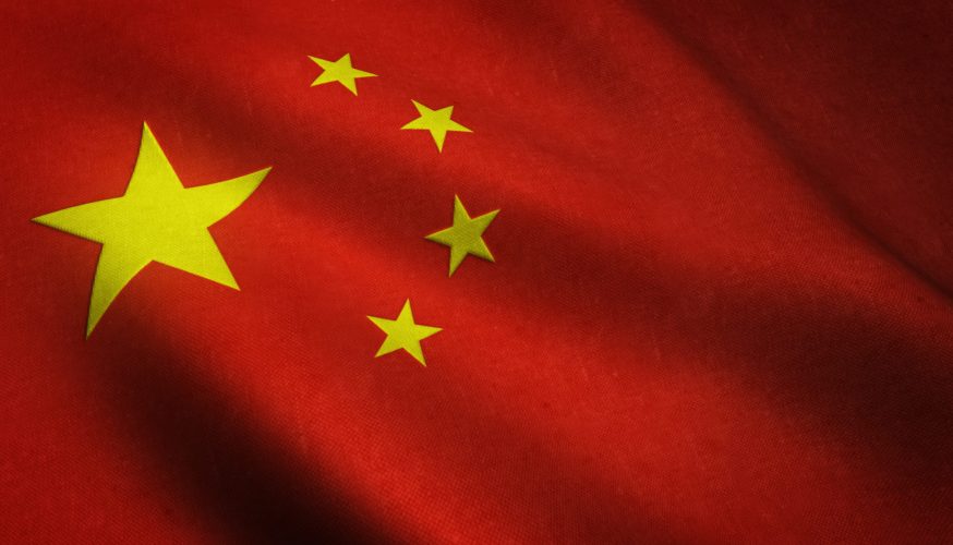 A realistic shot of the waving flag of China with interesting textures