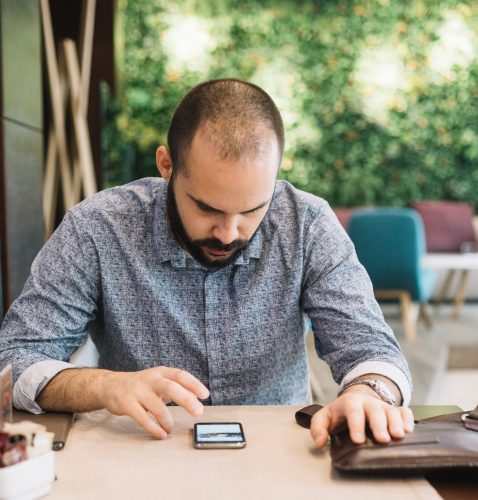 businessman-watching-phone-with-attention