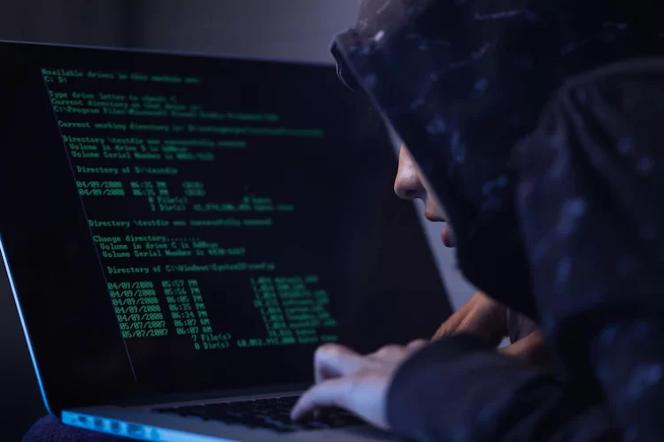 computer-hacker-hooded-shirt-typing-software-algorithms-stealing-data-from-computer-network-laptop_637285-147