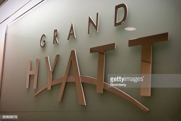 A sign hangs at the Grand Hyatt Hotel at the Dallas-Fort Worth International Airport in Dallas, Texas, U.S., on Thursday, Nov. 5, 2009.  Hyatt Hotels Corp., the chain controlled by Chicago's Pritzker family, climbed in its first day of trading as it raised $1.09 billion in the second-largest U.S. initial public offering this year. Photographer: Matt Nager/Bloomberg