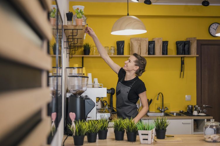 side-view-female-barista-working-coffee-shop