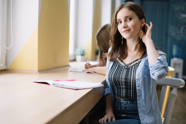 smiling-teen-student-desk